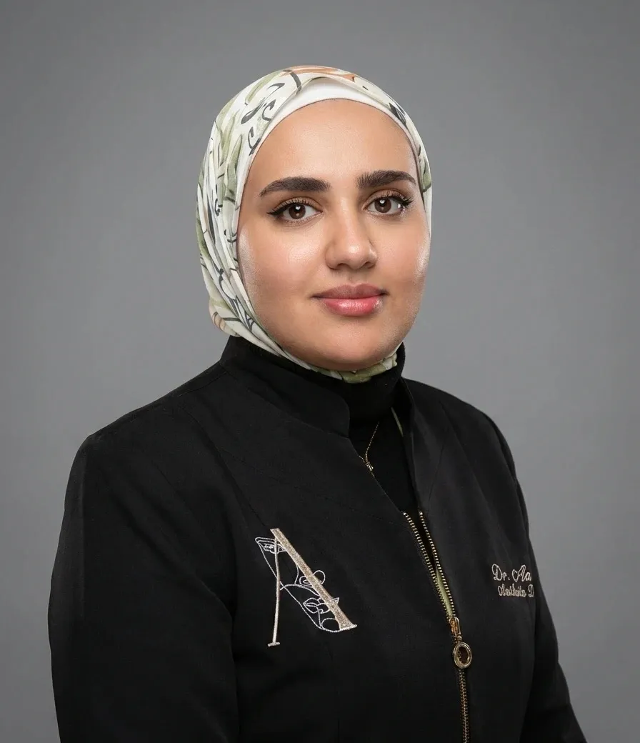 Portrait of Dr. Arwa Diab in a black clinic jacket with an embroidered A monogram